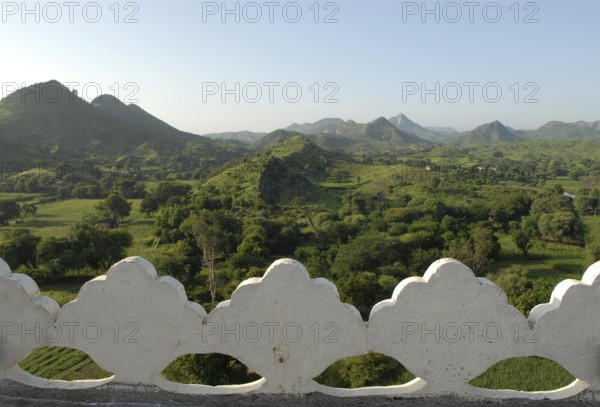Hilly, green landscape of Aravalli Mountains in monsoon, view from Palace Hotel Devigarh, Delwara