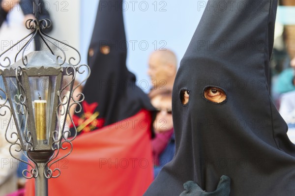 Good Friday procession, religious procession with participants in black robes, UNESCO World