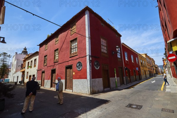 Historic street with red facades in sunshine, UNESCO World Heritage Old Town of San Crstobal de La