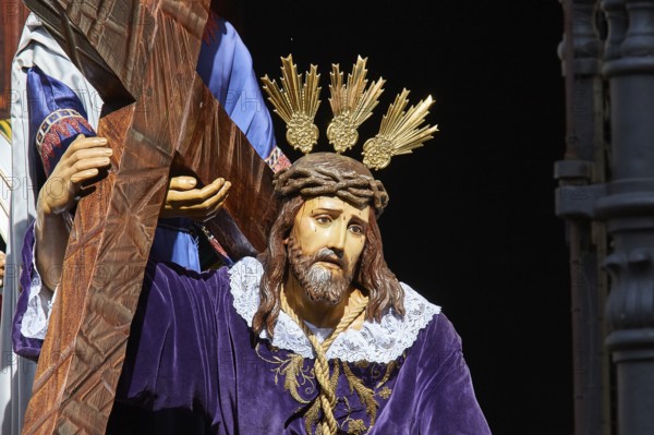 Good Friday procession, Jesus statue, with cross and crown of thorns, in purple robe, UNESCO World