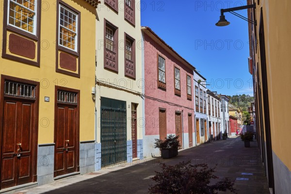 Narrow alley with colorful painted classic buildings and sunny weather, UNESCO World Heritage Old