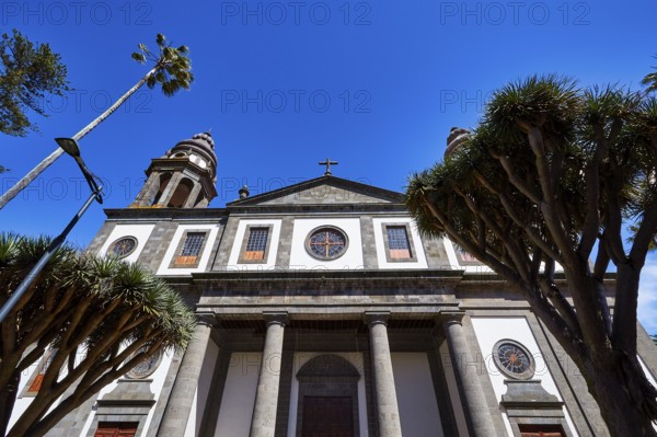 Nuestra Senora de los Remedios Cathedral, historic church with large arched windows and palm trees