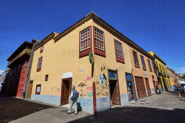 Corner with colorful historic houses and graffiti in bright sunshine, UNESCO World Heritage Old
