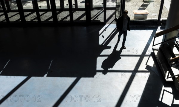 Foyer in a building of the Technical University of Berlin, light and shadow from people at the