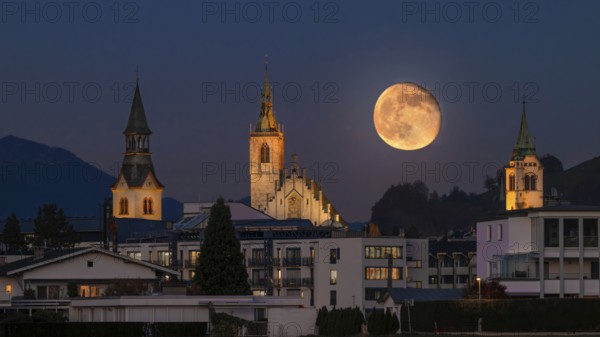 Hospital Church, Parish Church and New Bell Tower, just after full moon, Schwaz, Tyrol, Austria