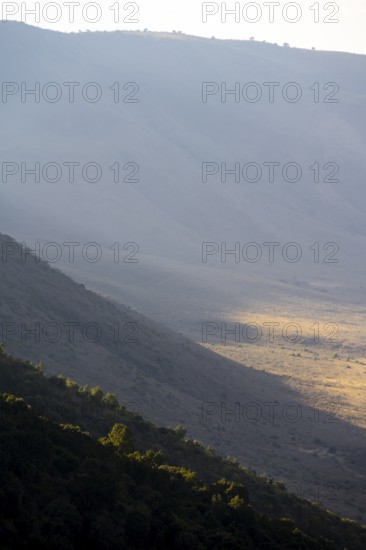 Mountain slopes of Ngorongoro Crater, Crater Viewpoint, in the evening light, Ngorongoro