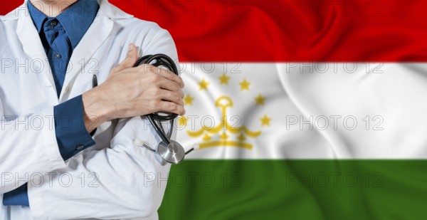 Tajikistan healthcare concept. Doctor with stethoscope on Tajikistan flag. Doctor holding