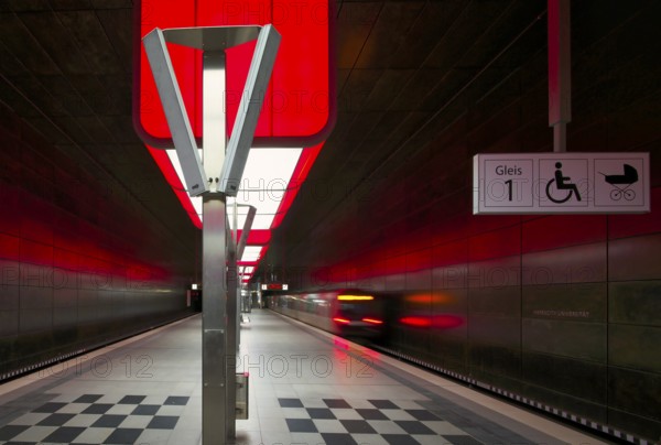 HafenCity University subway station, illuminated in color, red, underground train, movement effect,