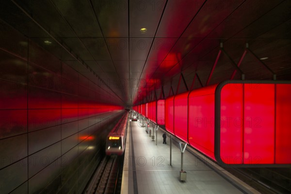 HafenCity University subway station, illuminated in color, red, underground train, movement effect,