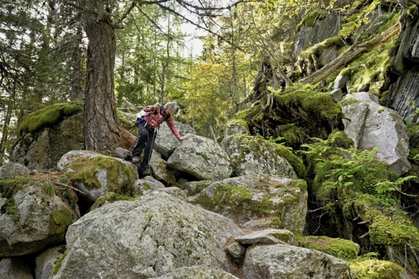 Female hiker on mountain tour in rocky terrain, Mont-Blanc, Chamonix-Mont-Blanc, Haute-Savoie,
