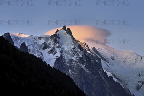 Aiguille du Midi with sun-lit cloud above the summit, Mont-Blanc, Chamonix-Mont-Blanc,