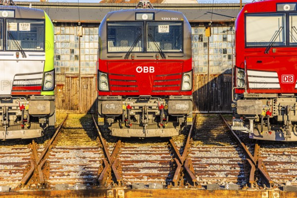 Modern locomotives of the Austrian Federal Railways, Ã–BB, and Deutsche Bahn, DB, parked in front