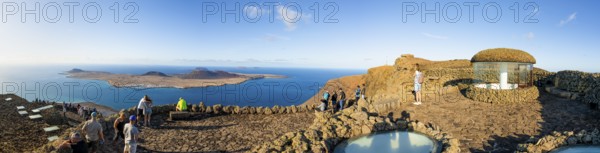 Stairway and tourists on the viewing platform at the Mirador del RÃ­o viewpoint, in the evening