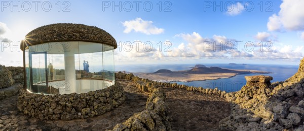 Stairway and viewing platform at the Mirador del RÃ­o viewpoint, in the evening light with sun