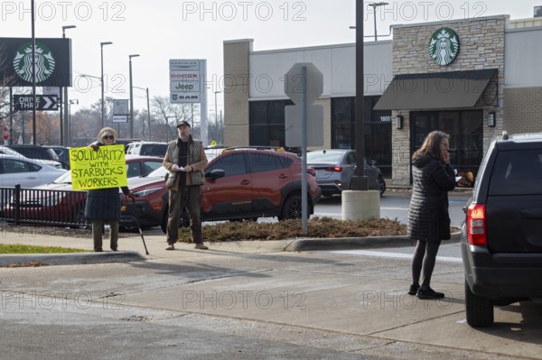 Detroit, Michigan USA - 15 November 2025 - People picket a Starbucks store in solidarity with a