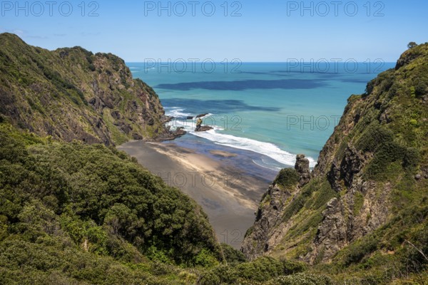 Landscape in New Zealand with sea and sandy beach. View of Mercer Bay. Mercer Bay Loop Walk hiking