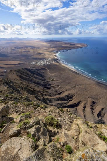 Castillejo viewpoint, view from the Risco de Famara cliffs to the coast and the sea with the Famara