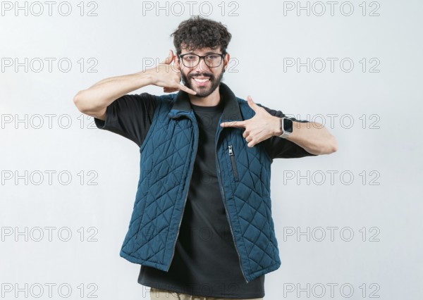 Handsome man gesturing CALL ME in sign language isolated. Person making gesture CALLING in