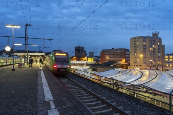 Essen-Steele S-Bahn station, passengers waiting for the train late afternoon, in autumn, Essen,