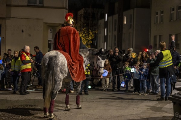 Martinszug in Essen-RÃ¼ttenscheid, the parish of St. Lambertus, Saint Martin actor on a horse, with