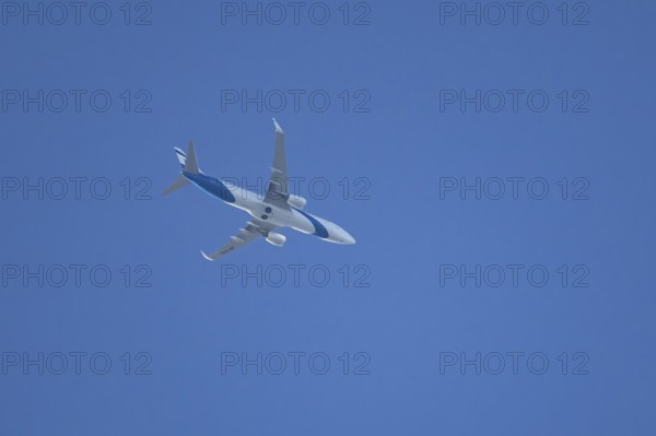 Boeing 737 jet passenger aircraft of El Al Israel airlines flying in a blue sky, England, United