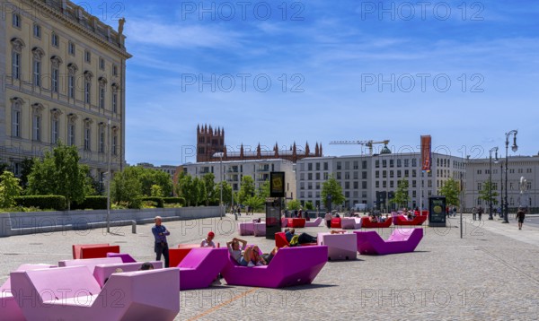 Colourful seating elements on the open space in front of the entrance to the Humboldt Forum,