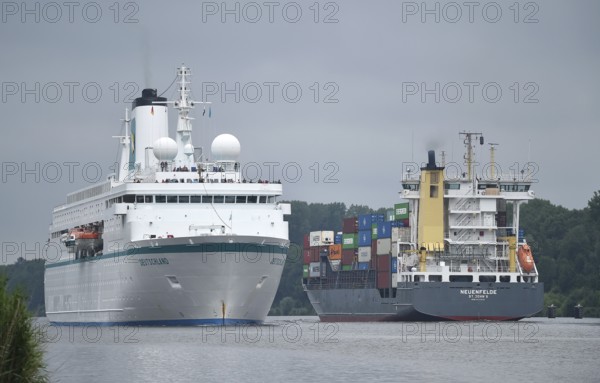 MS DEUTSCHLAND and container ship NEUENFELDE travelling through the Kiel Canal, Kiel Canal, Kiel