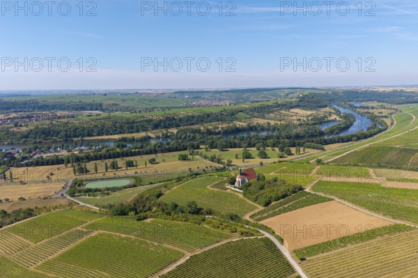 Pilgrimage church Maria im Weingarten, in a wide landscape of vineyards and fields along a large