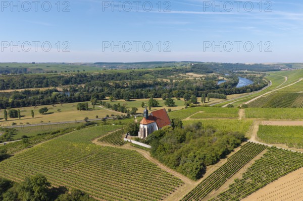 Pilgrimage church Maria im Weingarten, between vineyards, with river and green landscape in the