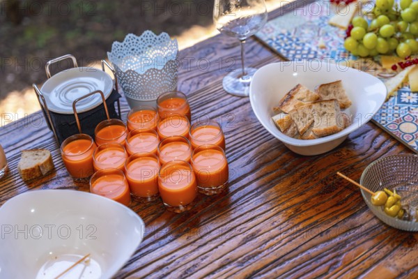 Elegant wedding reception setup featuring appetizers, vibrant decor, and rustic wooden table,