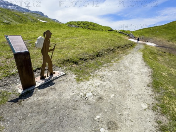 Information board on the left next to the Alpine Pass border pass road on early history and pass
