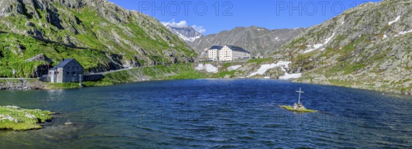 Panoramic photo of mountain lake Alpine lake Lac du Grand Gd Saint St Bernard, on the left Swiss