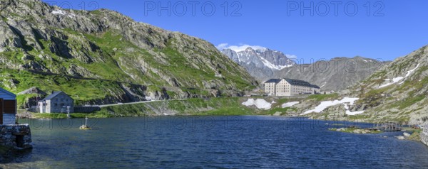 Panoramic photo of mountain lake Alpine lake Lac du Grand Gd Saint St Bernard, on the left Swiss