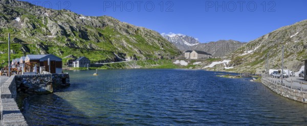 Panoramic photo of mountain lake Alpine lake Lac du Grand Gd Saint St Bernard, on the left souvenir