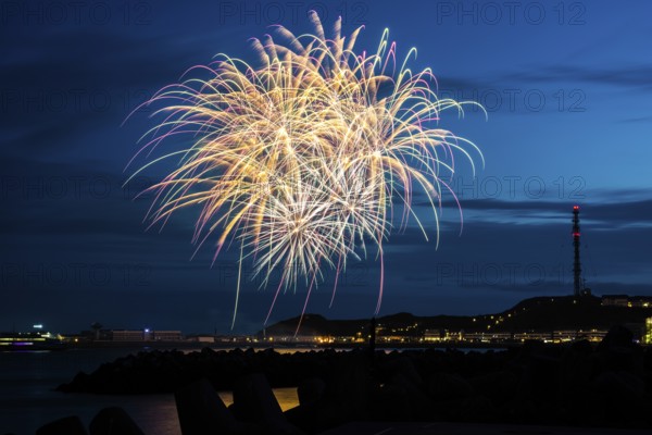 Atmospheric, splendid, intense fireworks with many illuminated sheaves for the Heligoland island