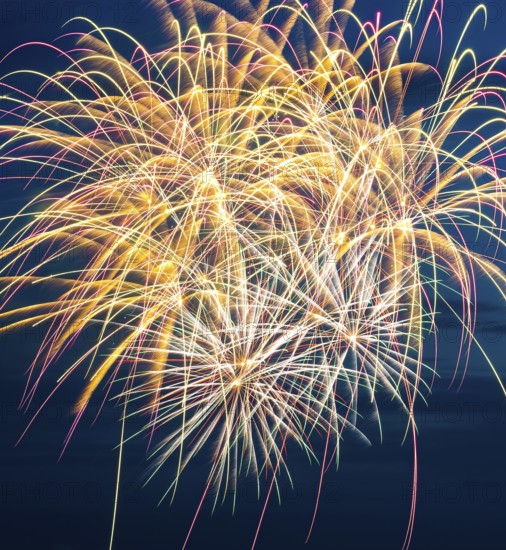 Brilliant fireworks with bright colours light up the night, atmospheric, magnificent, intense with