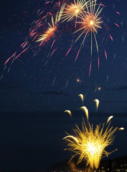 A brilliantly radiant, atmospheric firework display for the Heligoland island festival in red and