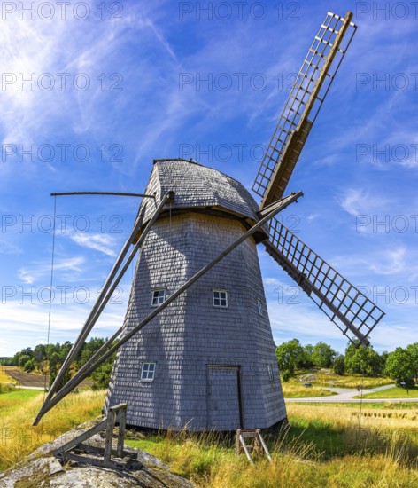 Historic windmill in an epic summer landscape near the burial ground of Stenhusbacken and the