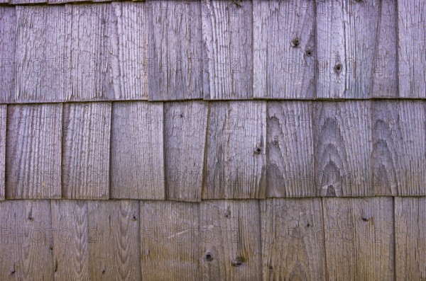 Traditional wooden shingles are used as panelling and façade cladding, exemplified on a historic