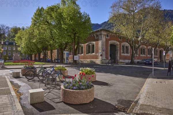 Historic buildings, bicycle stand, bicycle, flower pots, trees, backlight, blue sky, cloudless,