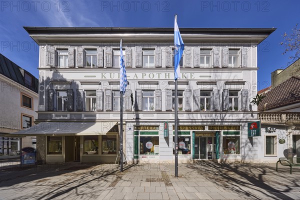 Kur-Apotheke, historical pharmacy, building, flagpoles, flags, facade, windows, entrance, doors,