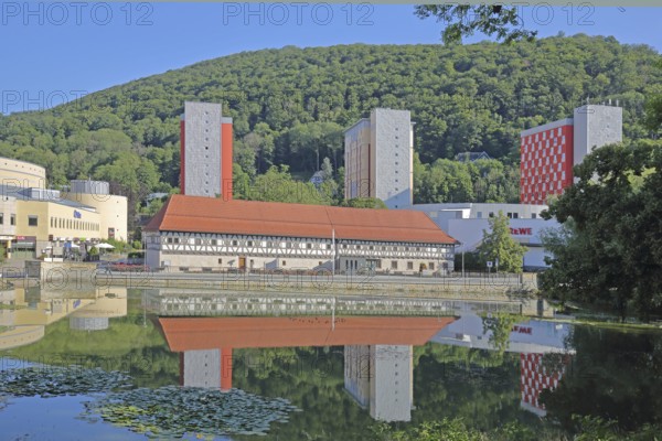Arms museum built in 1668 with modern skyscrapers and reflection, half-timbered house, pond,