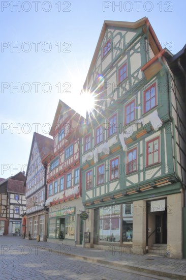 Red, green and brown half-timbered houses against the light, colourful, Auer Gasse, Schmalkalden,