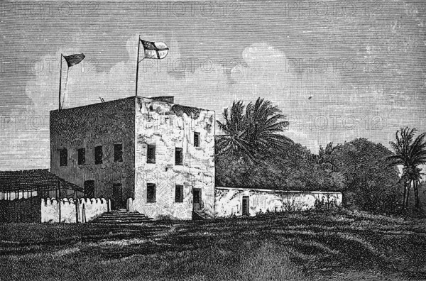 German station house in Bagamoyo, square building, former colony German East Africa, German flag,