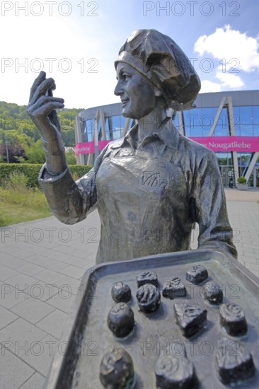 Sculpture confectioner with tray full of pralines for tasting, presentation, eating, enjoyment,