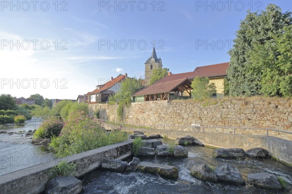 Werra with fish ladder, bank with stones, rocks, barrage, town wall, St Bartholomew's Church,