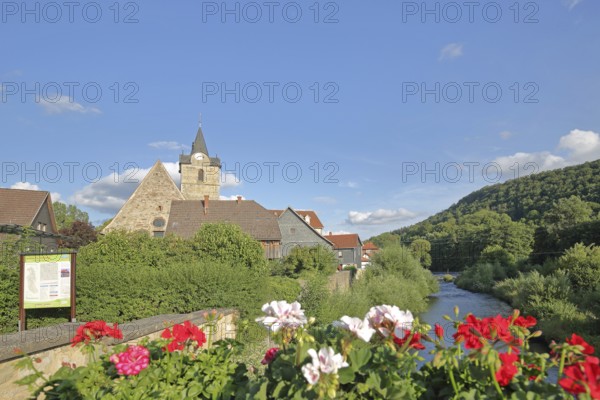Werra bridge with geraniums and St Bartholomew's Church, bank, houses, idyll, flower decoration,