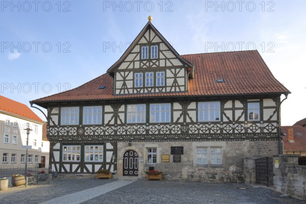 Historic official residence built in 1665, half-timbered house, hipped roof, Themar, fieldstone,