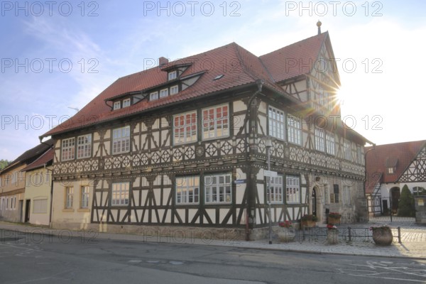 Historic official residence built in 1665 with backlight, half-timbered house, hipped roof, Themar,