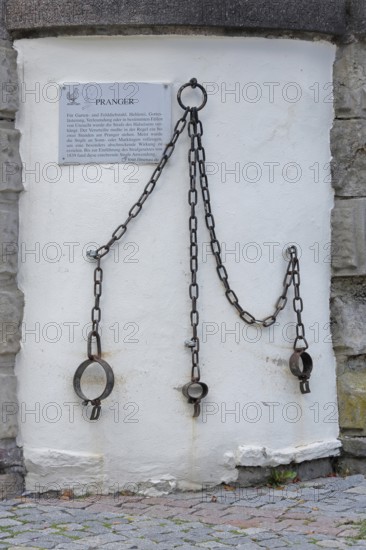 Medieval pillory with chains and rings, shackles, metal fittings, fittings, inscription, text, town
